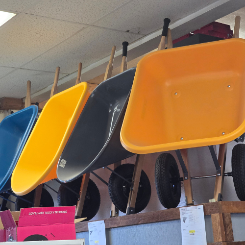 Wheel barrows on display inside of Clintonville Hardware and Rental.