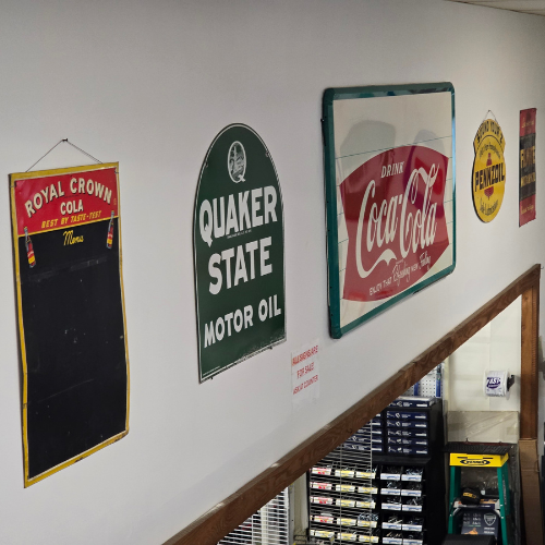 Garage signs and decor signs on display inside of Clintonville Hardware and Rental.