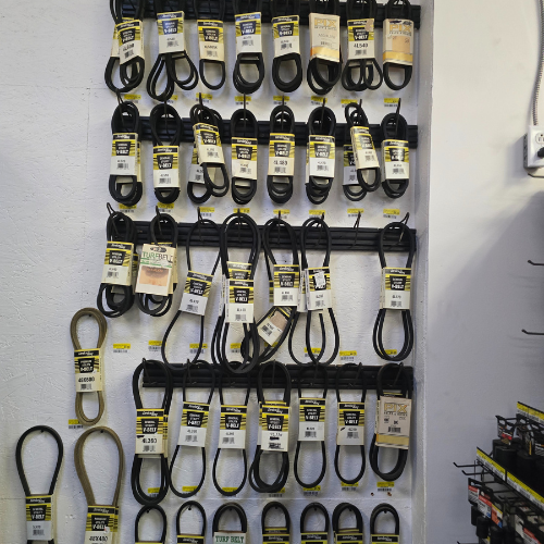 Mower belts on display inside of Clintonville Hardware and Rental.