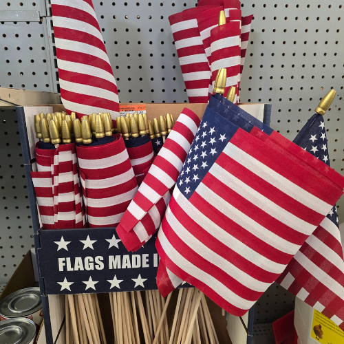 American flags on display inside of Clintonville Hardware and Rental.