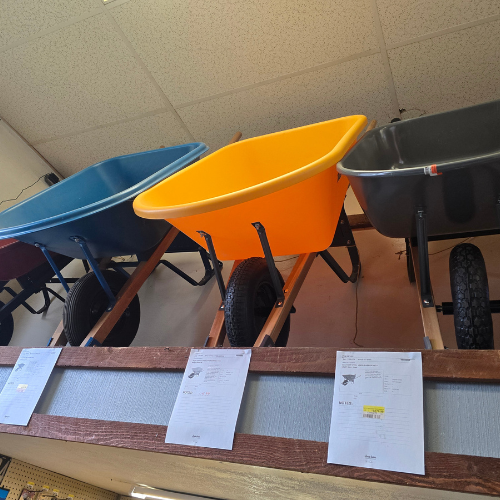 Wheel barrows on display inside of Clintonville Hardware and Rental.