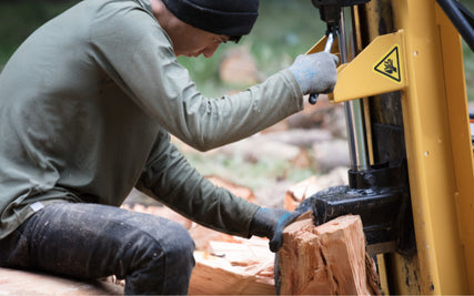 Equipment RentalsA close-up of a log splitter being used.